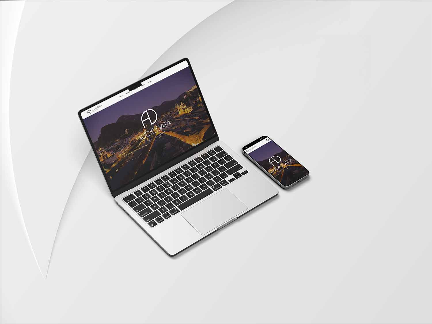 Mockup eines Macbooks and iPhones von der Audiodata Website